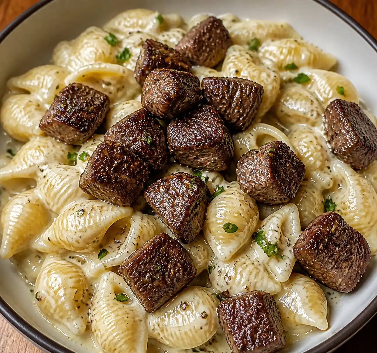 Steak Bites and Shell Pasta in Garlic Butter Alfredo Sauce